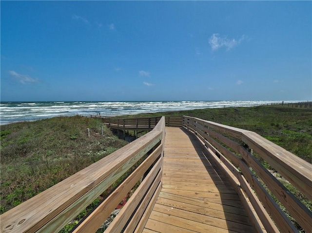 view of community with a view of the beach and a water view