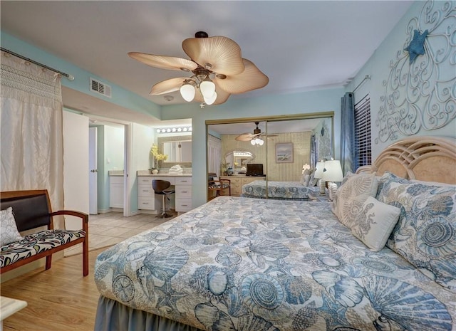 bedroom with visible vents, a closet, a ceiling fan, and light wood finished floors