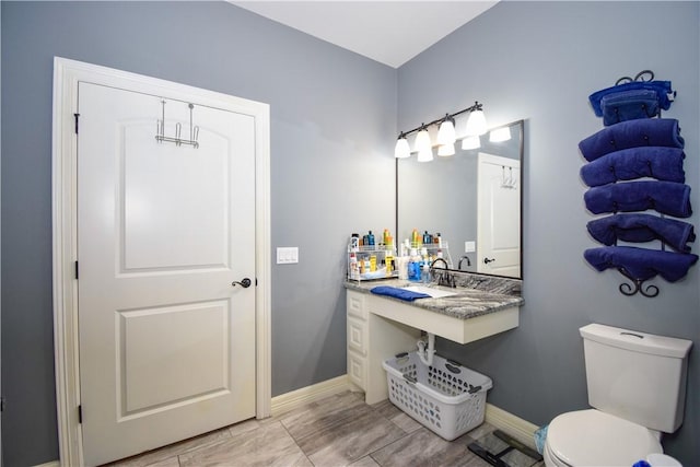 bathroom featuring toilet and sink