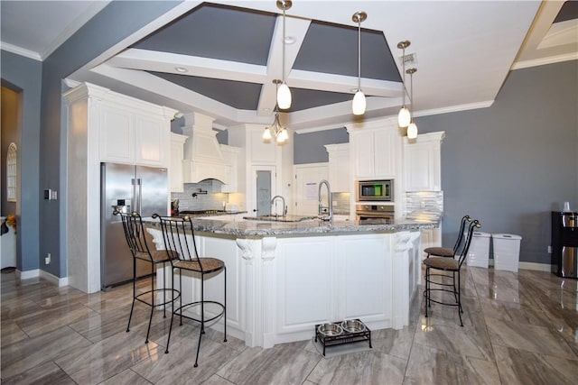 kitchen with custom exhaust hood, white cabinetry, stainless steel appliances, and hanging light fixtures