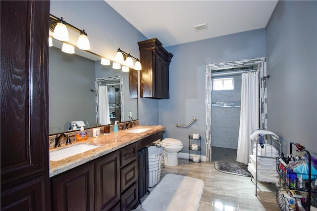 bathroom with a shower with curtain, vanity, and toilet