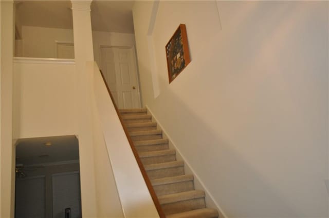 stairs featuring ornate columns