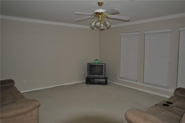 unfurnished living room featuring carpet floors, ornamental molding, and a ceiling fan