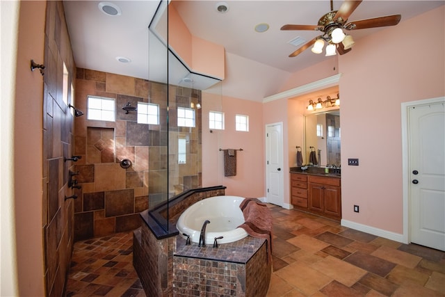 bathroom with vanity, a healthy amount of sunlight, and shower with separate bathtub