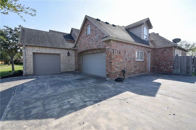 view of property exterior featuring a garage