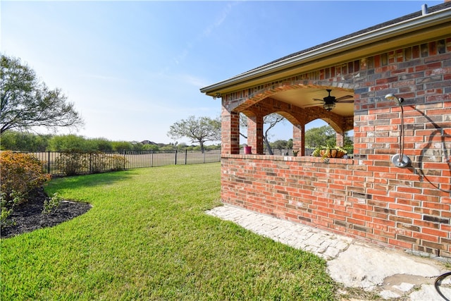 view of yard featuring ceiling fan