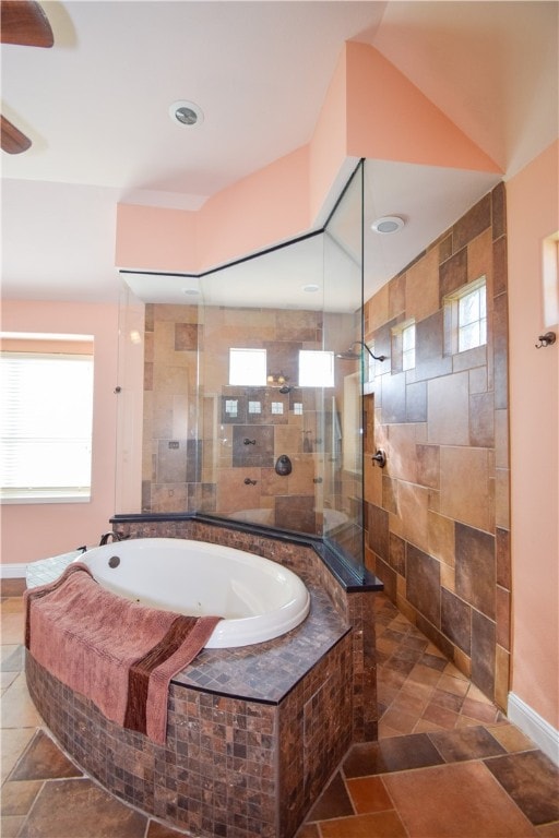 bathroom featuring plus walk in shower