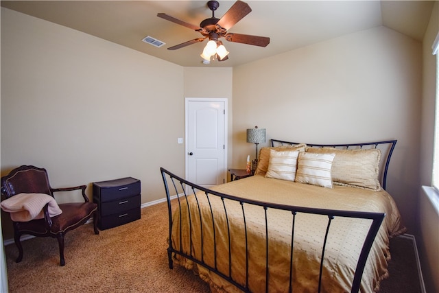 bedroom with ceiling fan, carpet floors, and lofted ceiling