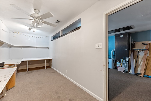 interior space featuring ceiling fan