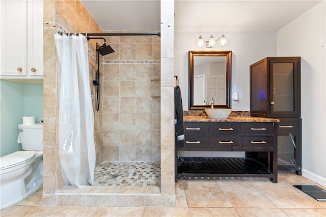 bathroom with walk in shower, tile patterned flooring, vanity, and toilet