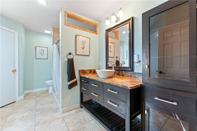 bathroom featuring vanity, tile patterned floors, toilet, and a shower with shower curtain