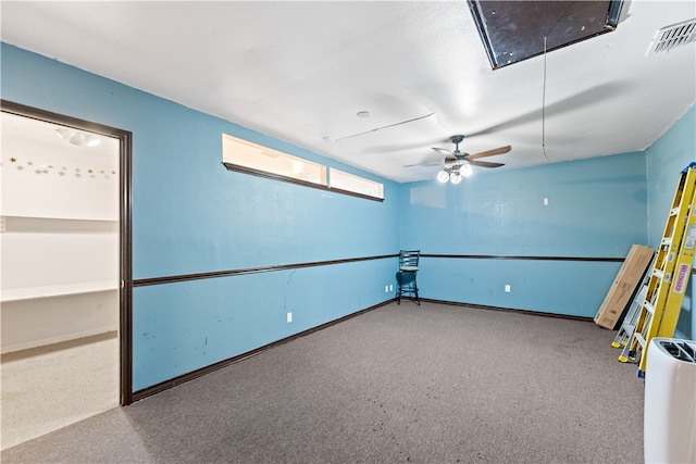 spare room featuring light colored carpet and ceiling fan