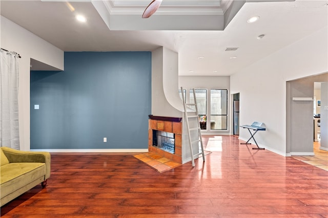 living room with hardwood / wood-style floors and a fireplace