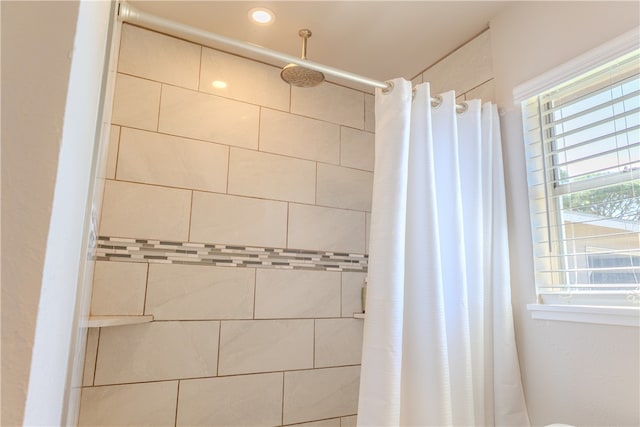 bathroom featuring curtained shower