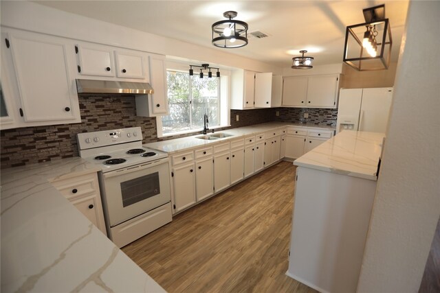 kitchen featuring tasteful backsplash, white cabinetry, extractor fan, sink, and white appliances