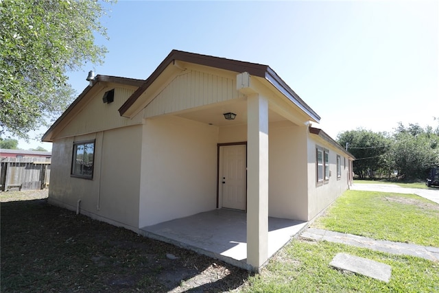 exterior space featuring a yard and a patio area