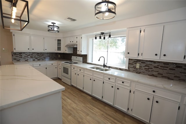 kitchen with white cabinetry, sink, light stone counters, white range with electric cooktop, and pendant lighting