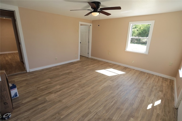 unfurnished bedroom with hardwood / wood-style floors and ceiling fan