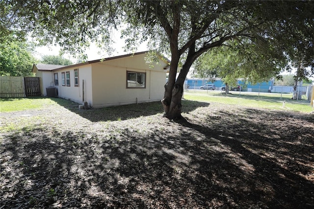 view of home's exterior with cooling unit