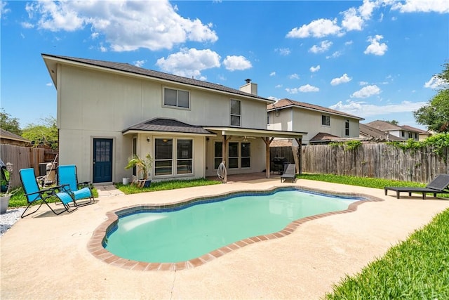 view of swimming pool featuring a fenced in pool, a fenced backyard, and a patio area