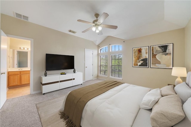 bedroom featuring ceiling fan, visible vents, light carpet, and lofted ceiling
