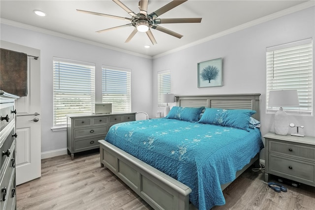 bedroom featuring light hardwood / wood-style floors, ceiling fan, and ornamental molding