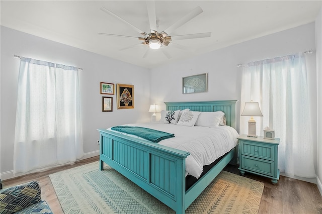 bedroom with hardwood / wood-style flooring and ceiling fan