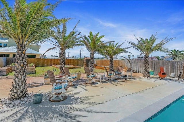 view of patio with an outdoor fire pit