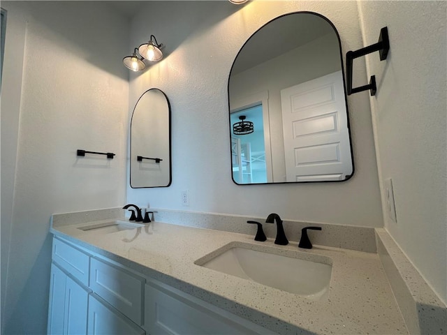 bathroom with double vanity and a sink