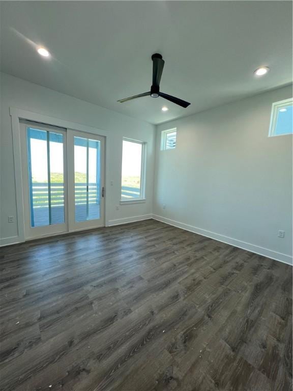 empty room featuring recessed lighting, baseboards, dark wood-style flooring, and ceiling fan