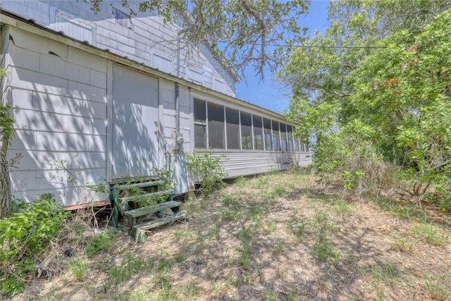 view of yard featuring a sunroom