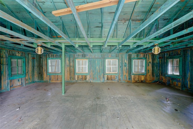 misc room featuring lofted ceiling and hardwood / wood-style flooring