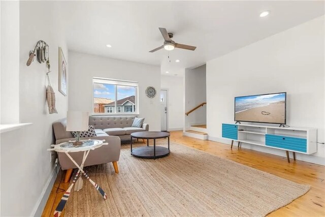 162 La Concha Blvd Unit 20, Port Aransas, TX 78373 - living room with wood finished floors, ceiling fan, stairs, and recessed lighting