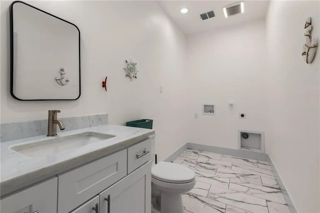 162 La Concha Blvd Unit 20, Port Aransas, TX 78373 - bathroom with marble finish flooring, vanity, and recessed lighting