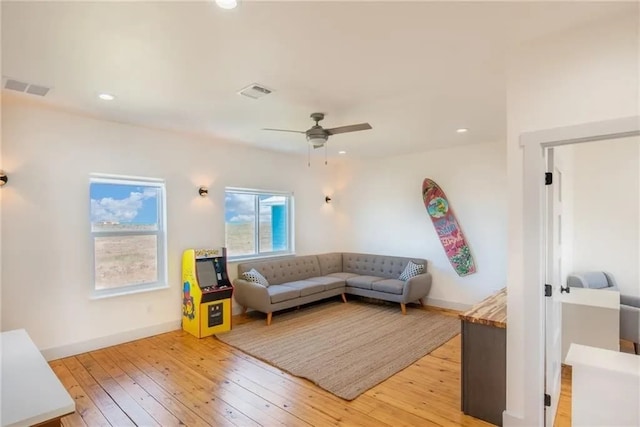 162 La Concha Blvd Unit 20, Port Aransas, TX 78373 - living room with light wood finished floors, a ceiling fan, and recessed lighting