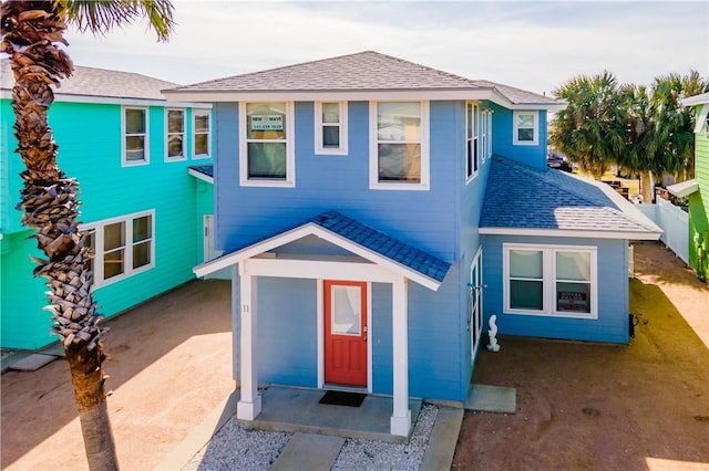 view of front of home featuring roof with shingles