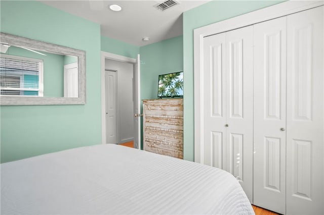 bedroom featuring a closet and visible vents