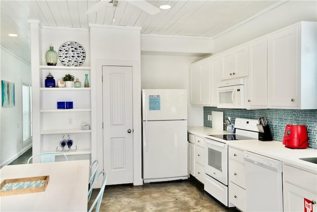 kitchen with white appliances, tasteful backsplash, white cabinets, and light countertops