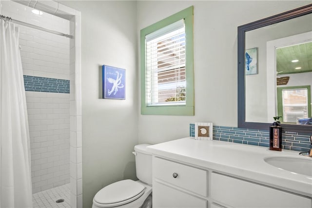 full bathroom featuring decorative backsplash, a shower stall, toilet, and vanity