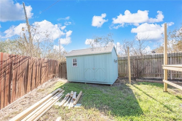 view of outbuilding featuring a lawn