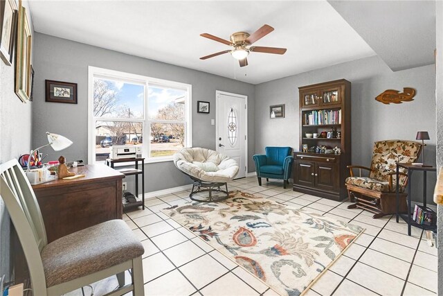 living area featuring light tile patterned floors and ceiling fan