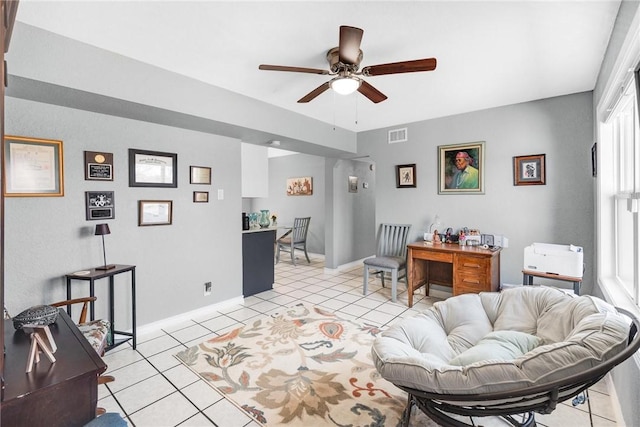 living room featuring ceiling fan, a healthy amount of sunlight, and light tile patterned floors