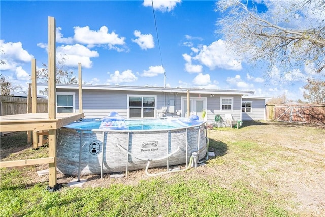 rear view of property with a yard