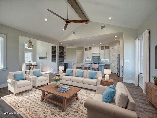 living room with hardwood / wood-style floors, high vaulted ceiling, sink, ceiling fan, and beamed ceiling