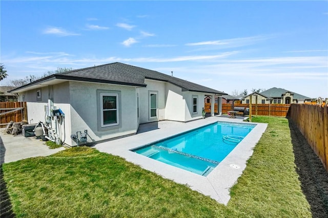 view of pool featuring a yard, a patio area, a fenced backyard, and a fenced in pool