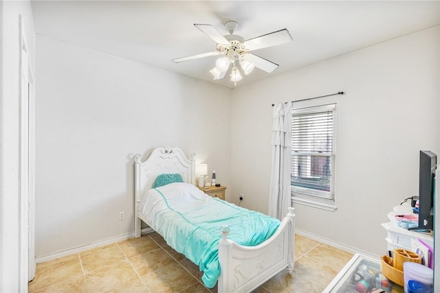 bedroom featuring ceiling fan, baseboards, and light tile patterned floors