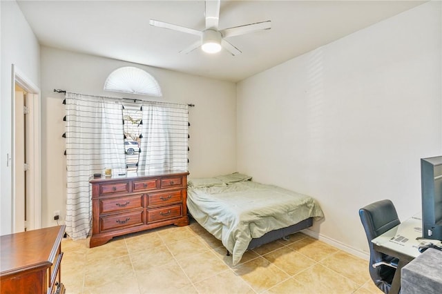 bedroom with light tile patterned floors, ceiling fan, and baseboards