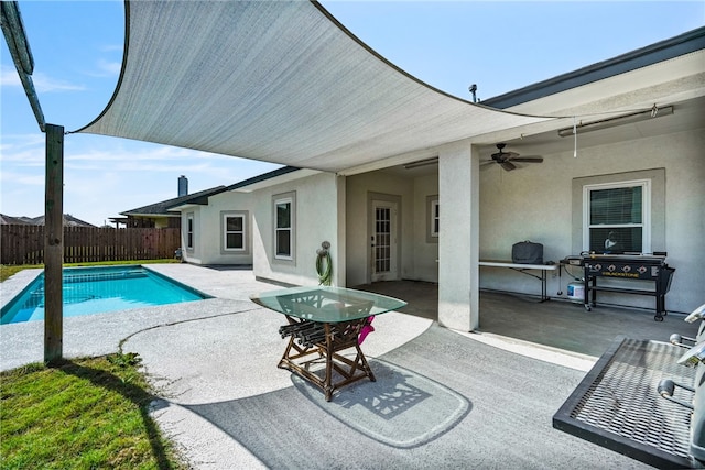 view of swimming pool featuring a fenced in pool, a patio, ceiling fan, a grill, and fence