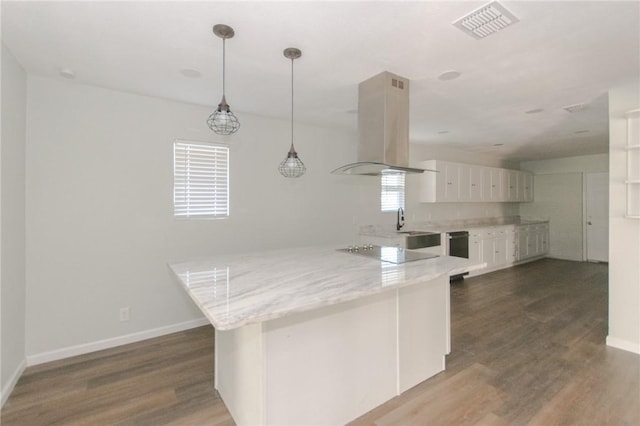 kitchen with island exhaust hood, visible vents, black electric stovetop, and wood finished floors