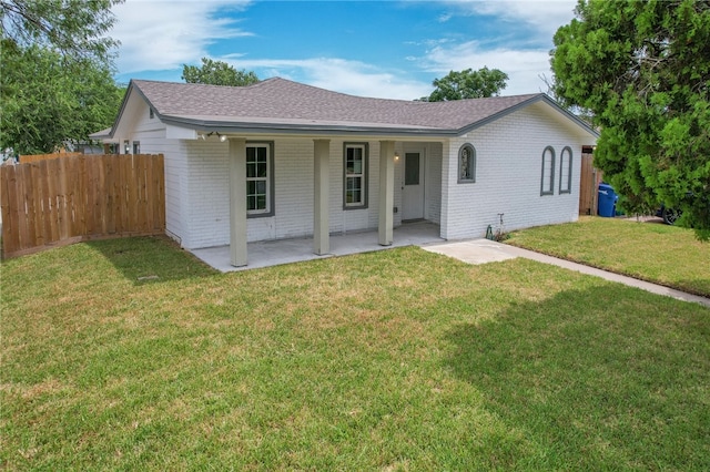 single story home featuring a patio and a front yard